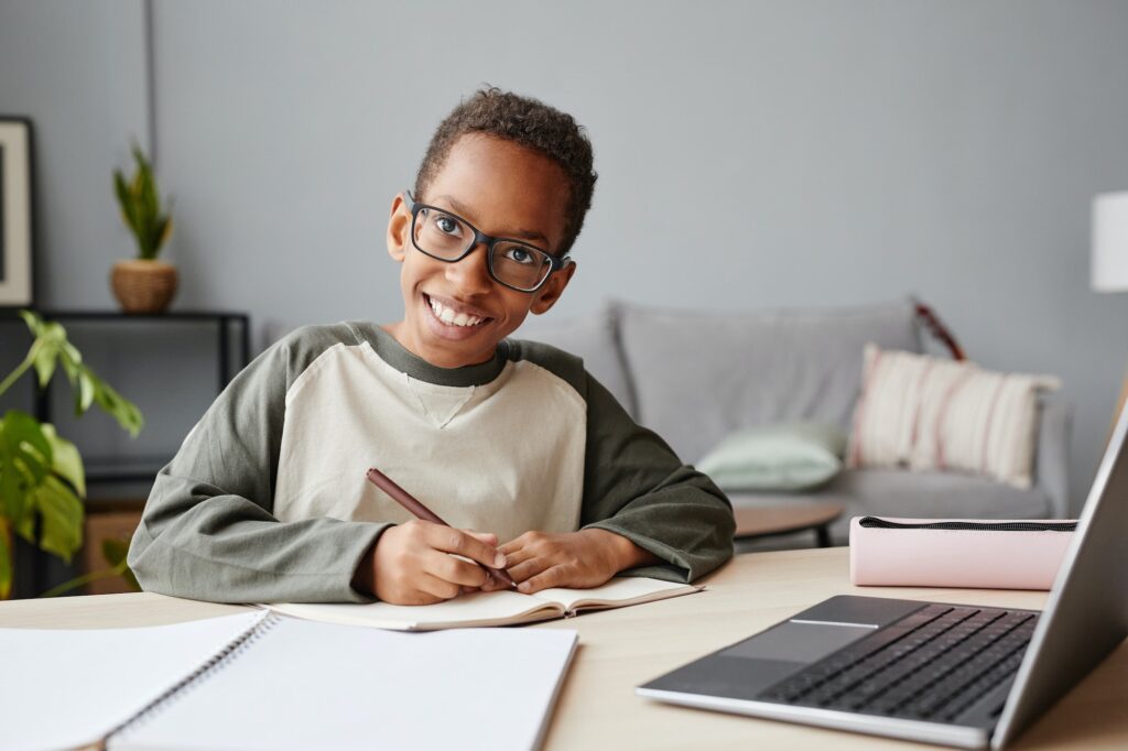 Smiling Boy Studying at Home
